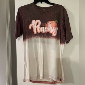 medium “just peachy” shirt. brown and white